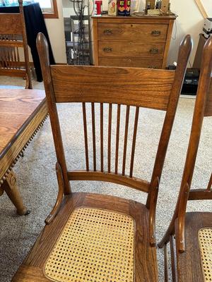 GORGEOUS ANTIQUE TABLE WITH 4 LEAVES AND 8 CANE SEAT CHAIRS