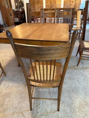 GORGEOUS ANTIQUE TABLE WITH 4 LEAVES AND 8 CANE SEAT CHAIRS