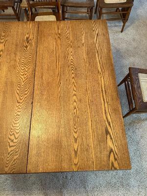 GORGEOUS ANTIQUE TABLE WITH 4 LEAVES AND 8 CANE SEAT CHAIRS