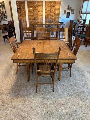 GORGEOUS ANTIQUE TABLE WITH 4 LEAVES AND 8 CANE SEAT CHAIRS