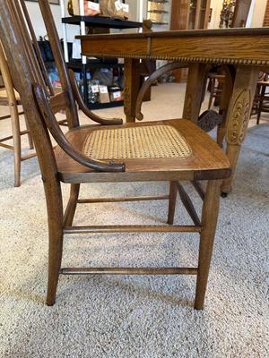 GORGEOUS ANTIQUE TABLE WITH 4 LEAVES AND 8 CANE SEAT CHAIRS