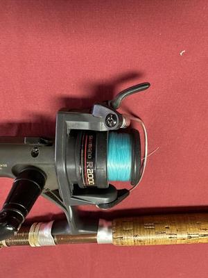 EAGLE CLAW AND WRIGHT AND MCGILL FISHING RODS AND A SHIMANO REEL