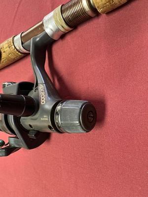 EAGLE CLAW AND WRIGHT AND MCGILL FISHING RODS AND A SHIMANO REEL