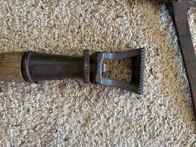 ANTIQUE BUTTERIS AND A BARBED WIRE FENCE STRETCHER?