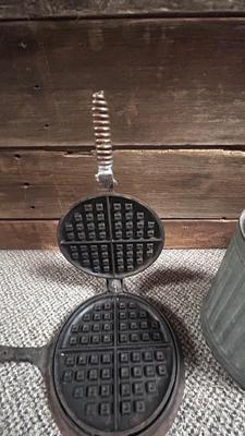 HIBBARD CAST IRON WAFFLE MAKER AND A FUEL JUG TO KEEP THE WAFFLES COOKING