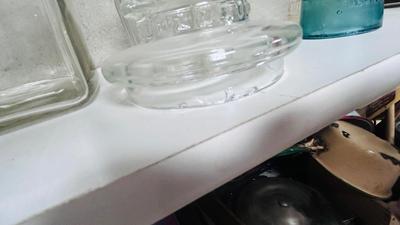 TURQUOISE INSULATORS AND GLASS BOTTLES SAVED FROM THE INCINERATOR