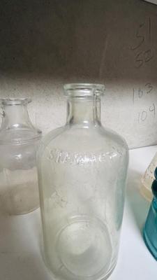 TURQUOISE INSULATORS AND GLASS BOTTLES SAVED FROM THE INCINERATOR