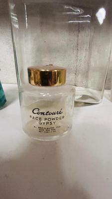 TURQUOISE INSULATORS AND GLASS BOTTLES SAVED FROM THE INCINERATOR