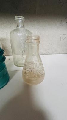 TURQUOISE INSULATORS AND GLASS BOTTLES SAVED FROM THE INCINERATOR