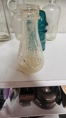 TURQUOISE INSULATORS AND GLASS BOTTLES SAVED FROM THE INCINERATOR