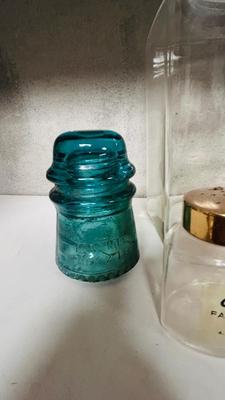 TURQUOISE INSULATORS AND GLASS BOTTLES SAVED FROM THE INCINERATOR