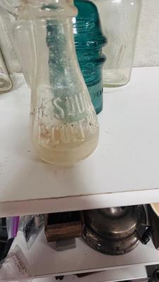 TURQUOISE INSULATORS AND GLASS BOTTLES SAVED FROM THE INCINERATOR