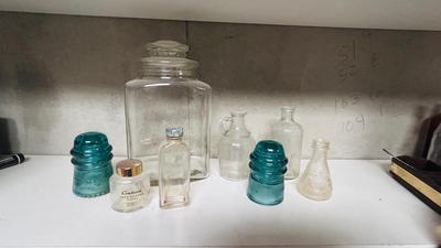 TURQUOISE INSULATORS AND GLASS BOTTLES SAVED FROM THE INCINERATOR
