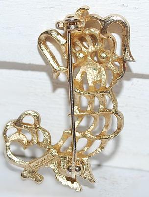 Marked "AVON" GREEN-EYED DOG BROOCH ( 1¾" x 1¼") on a Gold Tone Setting