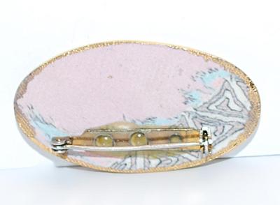Long OVAL BROOCH (2" x 1") with Pinks & Blues Graphic Design and Gold Colored Edge on a Composite Setting