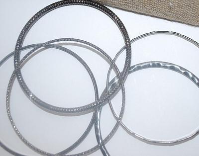 Collection of 5 Black BANGLE BRACELETS (2½" Opening) with Assorted Finishes