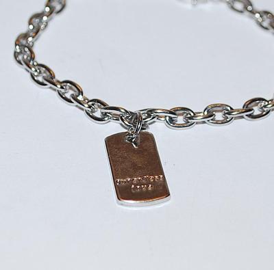 "OUR ENDLESS LOVE" Engraved Tag BRACELET (2¾" Opening) with Silver Tone Links and Lobster Clasp