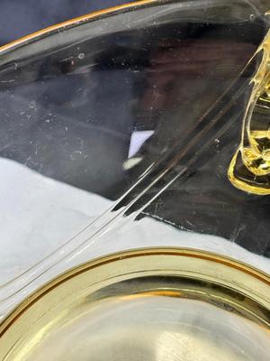 Sale Photo Thumbnail #91: 1930s amber yellow color shows slight signs of use , and has some black crumbs stuck in the edge of one of the wings. I have not cleaned aggressively. Winged plume handles sh0w off this rare topaz color Art Deco piece.