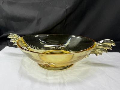 Sale Photo Thumbnail #88: 1930s amber yellow color shows slight signs of use , and has some black crumbs stuck in the edge of one of the wings. I have not cleaned aggressively. Winged plume handles sh0w off this rare topaz color Art Deco piece.