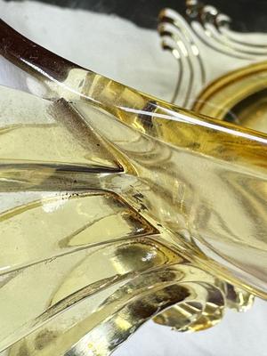 Sale Photo Thumbnail #90: 1930s amber yellow color shows slight signs of use , and has some black crumbs stuck in the edge of one of the wings. I have not cleaned aggressively. Winged plume handles sh0w off this rare topaz color Art Deco piece.