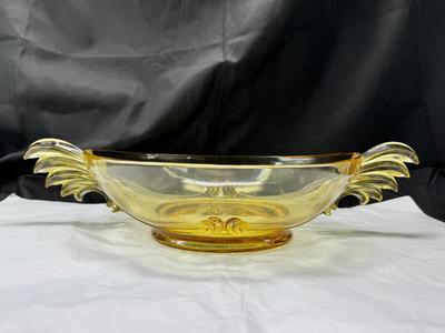 Sale Photo Thumbnail #92: 1930s amber yellow color shows slight signs of use , and has some black crumbs stuck in the edge of one of the wings. I have not cleaned aggressively. Winged plume handles sh0w off this rare topaz color Art Deco piece.