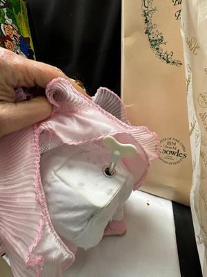 Sale Photo Thumbnail #131: German and French bru Spanish Dancer, plastic doll without her head. madam Alexander book. Porcelain babies, soft ethnic dolls. I found the other boot for the wood chopper. There are 2 music box dolls, and a Raggedy Andy. 2 bells