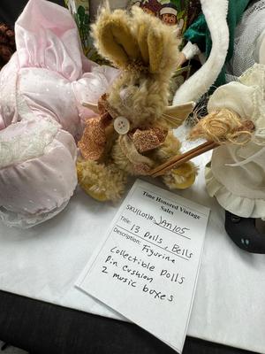 Sale Photo Thumbnail #134: German and French bru Spanish Dancer, plastic doll without her head. madam Alexander book. Porcelain babies, soft ethnic dolls. I found the other boot for the wood chopper. There are 2 music box dolls, and a Raggedy Andy. 2 bells