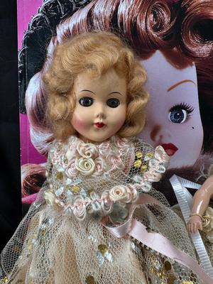 Sale Photo Thumbnail #98: German and French bru Spanish Dancer, plastic doll without her head. madam Alexander book. Porcelain babies, soft ethnic dolls. I found the other boot for the wood chopper. There are 2 music box dolls, and a Raggedy Andy. 2 bells