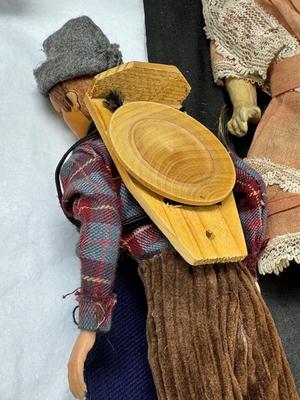 Sale Photo Thumbnail #107: German and French bru Spanish Dancer, plastic doll without her head. madam Alexander book. Porcelain babies, soft ethnic dolls. I found the other boot for the wood chopper. There are 2 music box dolls, and a Raggedy Andy. 2 bells