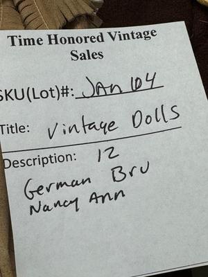 Sale Photo Thumbnail #113: German and French bru Spanish Dancer, plastic doll without her head. madam Alexander book. Porcelain babies, soft ethnic dolls. I found the other boot for the wood chopper. There are 2 music box dolls, and a Raggedy Andy. 2 bells