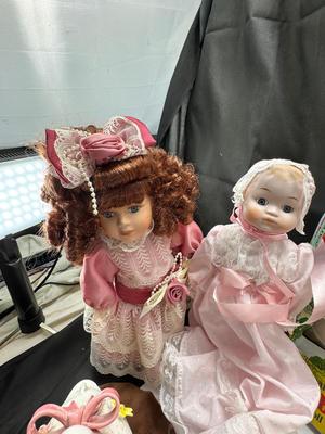 Sale Photo Thumbnail #125: German and French bru Spanish Dancer, plastic doll without her head. madam Alexander book. Porcelain babies, soft ethnic dolls. I found the other boot for the wood chopper. There are 2 music box dolls, and a Raggedy Andy. 2 bells