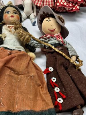 Sale Photo Thumbnail #109: German and French bru Spanish Dancer, plastic doll without her head. madam Alexander book. Porcelain babies, soft ethnic dolls. I found the other boot for the wood chopper. There are 2 music box dolls, and a Raggedy Andy. 2 bells