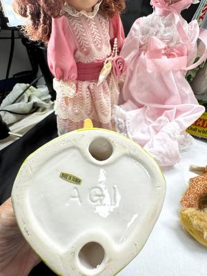 Sale Photo Thumbnail #127: German and French bru Spanish Dancer, plastic doll without her head. madam Alexander book. Porcelain babies, soft ethnic dolls. I found the other boot for the wood chopper. There are 2 music box dolls, and a Raggedy Andy. 2 bells