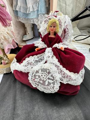 Sale Photo Thumbnail #119: German and French bru Spanish Dancer, plastic doll without her head. madam Alexander book. Porcelain babies, soft ethnic dolls. I found the other boot for the wood chopper. There are 2 music box dolls, and a Raggedy Andy. 2 bells