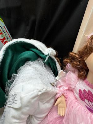Sale Photo Thumbnail #132: German and French bru Spanish Dancer, plastic doll without her head. madam Alexander book. Porcelain babies, soft ethnic dolls. I found the other boot for the wood chopper. There are 2 music box dolls, and a Raggedy Andy. 2 bells