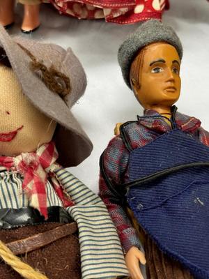 Sale Photo Thumbnail #106: German and French bru Spanish Dancer, plastic doll without her head. madam Alexander book. Porcelain babies, soft ethnic dolls. I found the other boot for the wood chopper. There are 2 music box dolls, and a Raggedy Andy. 2 bells