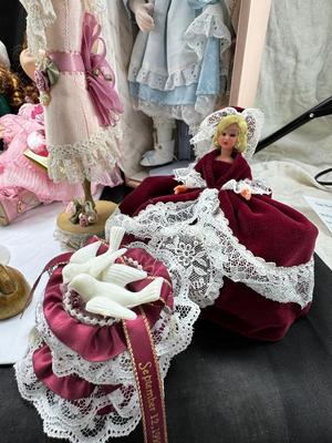 Sale Photo Thumbnail #118: German and French bru Spanish Dancer, plastic doll without her head. madam Alexander book. Porcelain babies, soft ethnic dolls. I found the other boot for the wood chopper. There are 2 music box dolls, and a Raggedy Andy. 2 bells