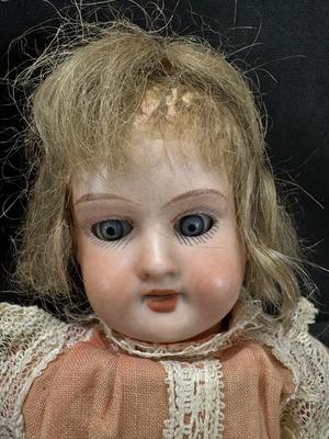 Sale Photo Thumbnail #103: German and French bru Spanish Dancer, plastic doll without her head. madam Alexander book. Porcelain babies, soft ethnic dolls. I found the other boot for the wood chopper. There are 2 music box dolls, and a Raggedy Andy. 2 bells