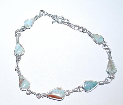 Delicate Pear Shaped Jade-Style BRACELET (2⅛" Opening) with Marked Blue Color Stones and Silver Tone Setting and Wire Hook Clasp
