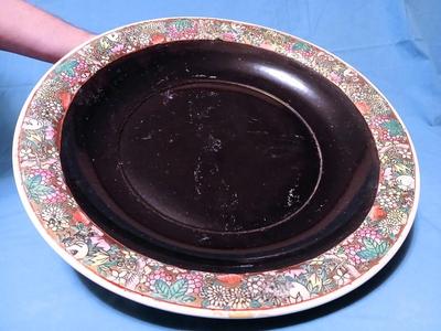 Sale Photo Thumbnail #82: Unmarked. Some wear/tape residue to black glaze. 18 1/4" diam. x 3 1/4" high.