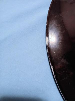 Sale Photo Thumbnail #87: Unmarked. Some wear/tape residue to black glaze. 18 1/4" diam. x 3 1/4" high.