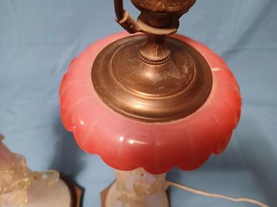 Sale Photo Thumbnail #114: Body of Pink & white opalescent striated ombre effect w/clear pale chartreuse floral vine applied. Bronze metal mounts. Base 6", 13 3/4" high, 27" high incl. shades. One in great condition, the other with crack at base, needing better repair. Shades inclu