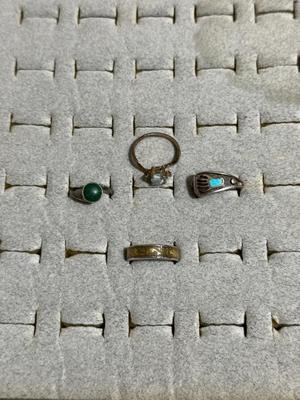 OPAL COLORED STONE RING IS 18K HGE, BEAR CLAW RING, RING WITH DOLPHINS AROUND BAND, AND A RING WITH GREEN STONE