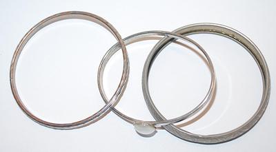 Collection of 3 Silver Colored BANGLE BRACELETS (2½" Opening) with Embossed Designs and 1 with Opaque Cabochon