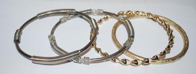 Collection of 4 BRACELETS (-2½"+ Opening) with Silver "Springs" and Brushed and Swirls Gold Tone Settings