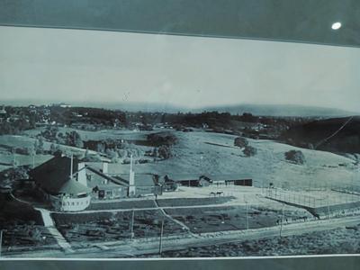 Sale Photo Thumbnail #324: San Gabriel Valley/Mountains in Glazed Black Frame and gray mat. Probably a later print. Frame 53 1/2" x 12 1/2", Image 47 3/4" x 7".