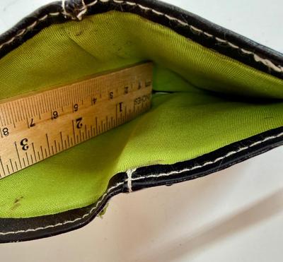 Sale Photo Thumbnail #597: This is a black Disney Tinker Bell vinyl wallet with glitter accents. Snap closure, zippered coin pouch.  Holds credit cards inside, full-size bill-fold pocket. Very Good condition.