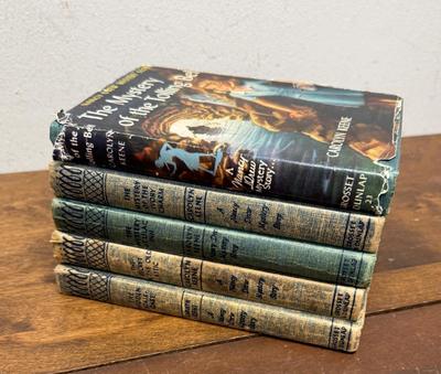 Sale Photo Thumbnail #144: Lot of 5 books. Titles include “The Mystery of the Tolling Bell”, “The Mystery of the Ivory Charm”, and “The Secret in the Old Attic”.