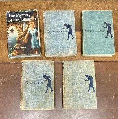 Sale Photo Thumbnail #143: Lot of 5 books. Titles include “The Mystery of the Tolling Bell”, “The Mystery of the Ivory Charm”, and “The Secret in the Old Attic”.