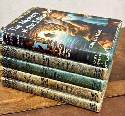 Sale Photo Thumbnail #141: Lot of 5 books. Titles include “The Mystery of the Tolling Bell”, “The Mystery of the Ivory Charm”, and “The Secret in the Old Attic”.